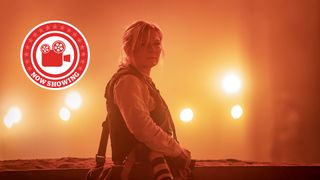 kirsten dunst in civil war against an orange background 