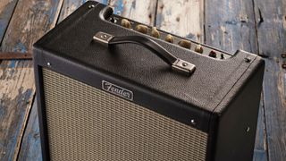 Close up of the top panel of Fender Blues Junior IV tube amp on a wooden floor