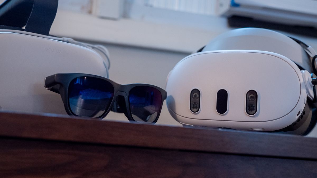 A Meta Quest 3, Meta Quest 2, and a pair of Viture One smart glasses together