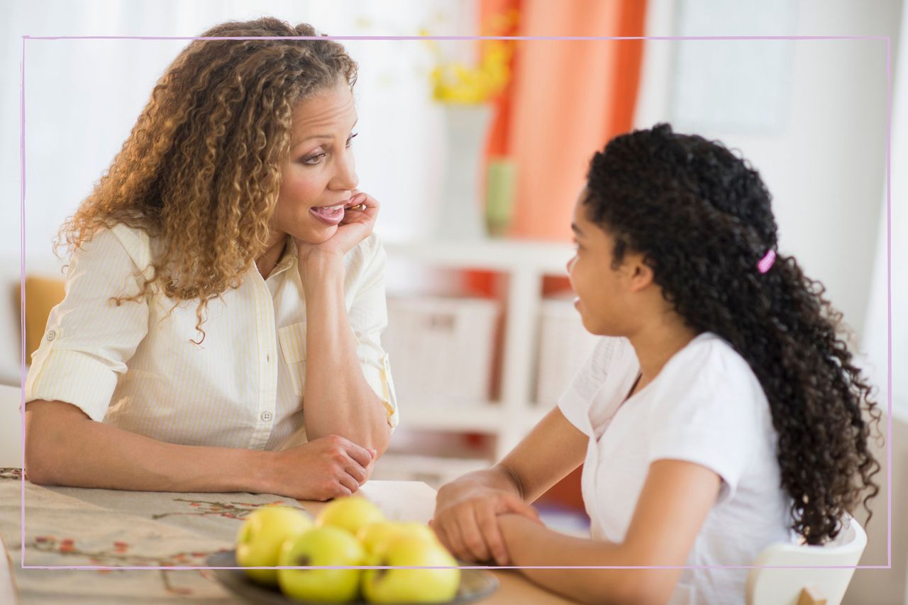 Mother and daughter having a conversation at the table