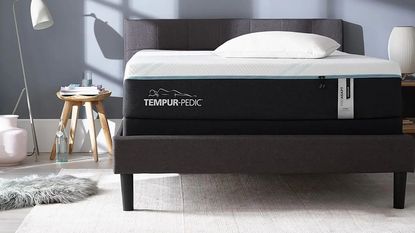 Tempur-Pedic ProAdapt Mattress on a bed against a blue-gray wall.