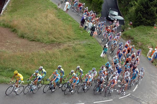 Astana leads the peloton up the Col des Saisies.