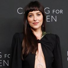 Dakota Johnson's black cut-out gown from Valentino shows off her witchy diamond necklace