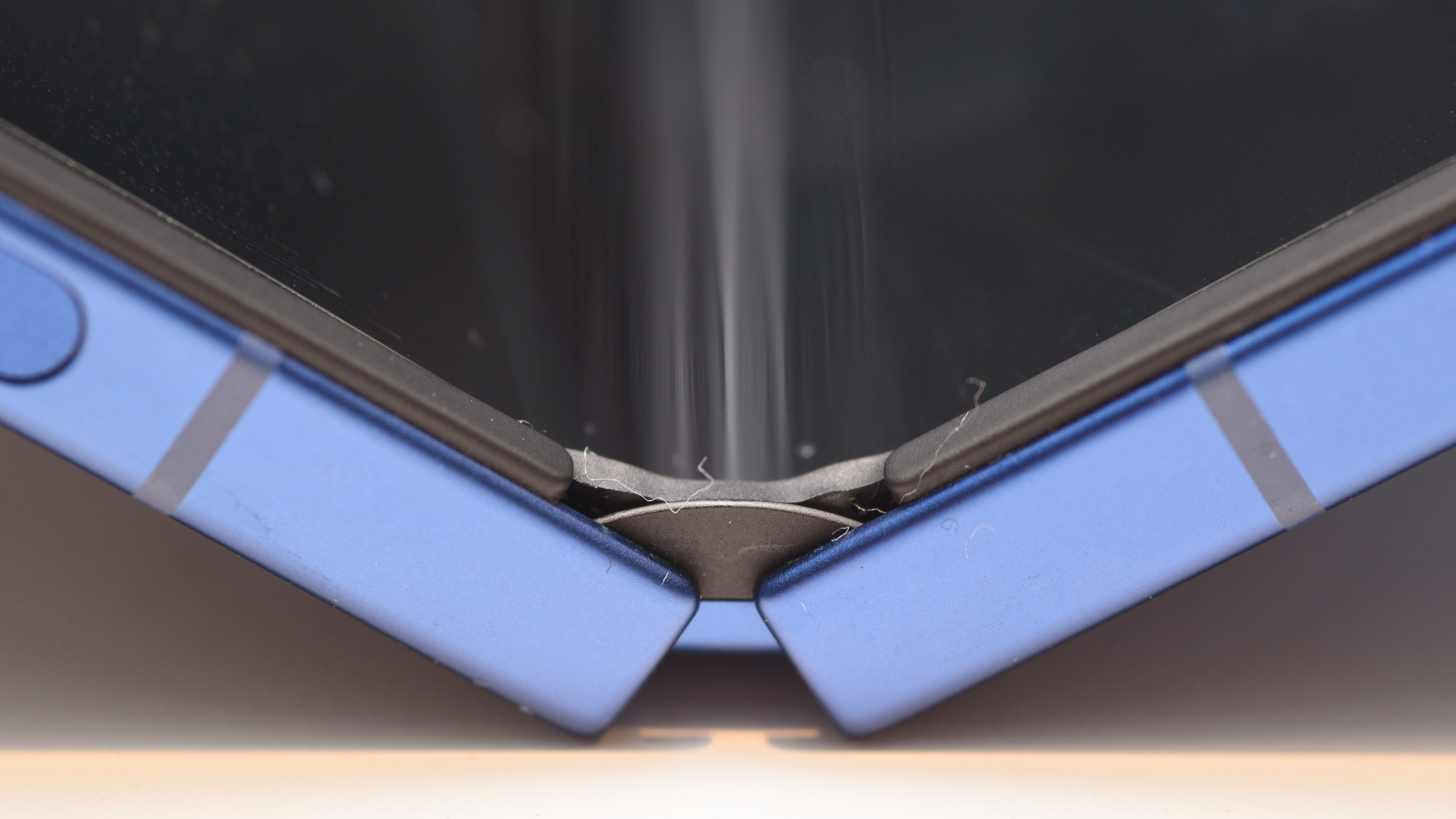 Samsung Galaxy Z Flip 7 in blue close up on the hinge and bending glass