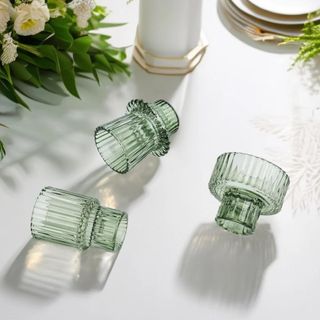 Three glass, fluted, green candle holders