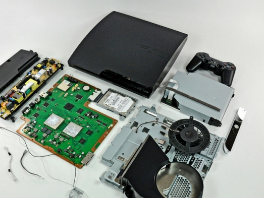 PS3 Slim torn to pieces