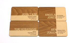 A business card design engraved in wood