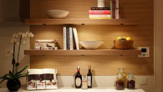 wooden wall shelves with underlighting from John Cullen