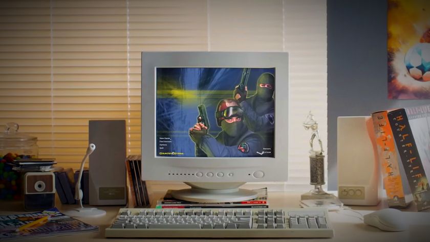 Counter-Strike 2 release trailer screenshot showing an old-style white desktop PC running the Counter-Strike menu atop a wooden desk