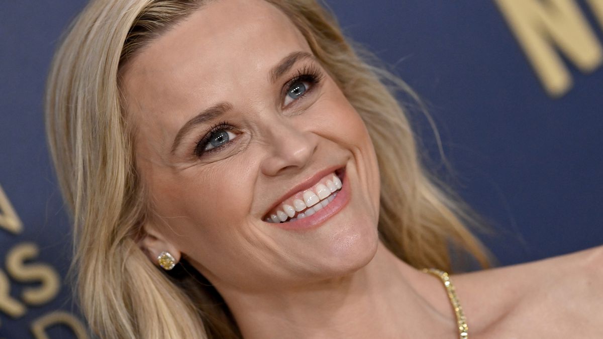 Reese Witherspoon swaps all-American look for chic Scandi style in chunky trainers and cool blue knit