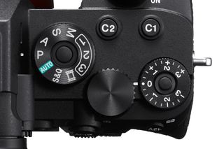 The exposure mode dial on the A7R IV (pictured) has a locking button in its center