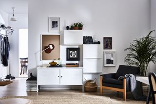 A modern white living room with storage by Ikea