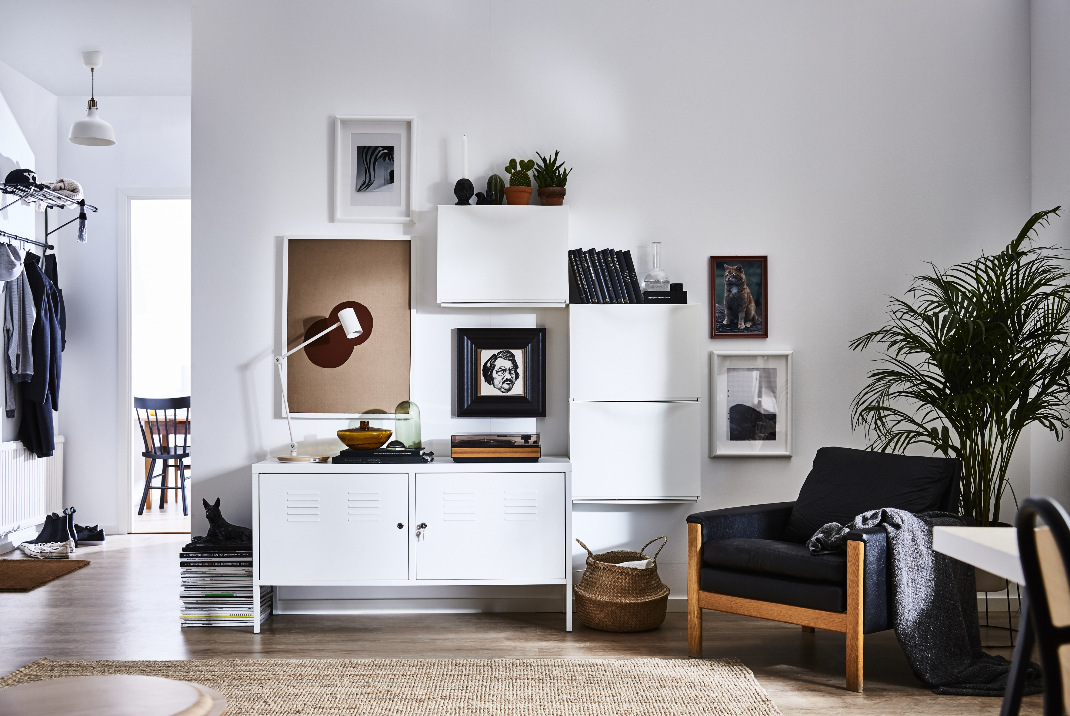 A modern white living room with storage by Ikea