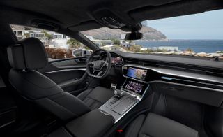 The dark-toned front-seat interior of the Audi A7 Sportback