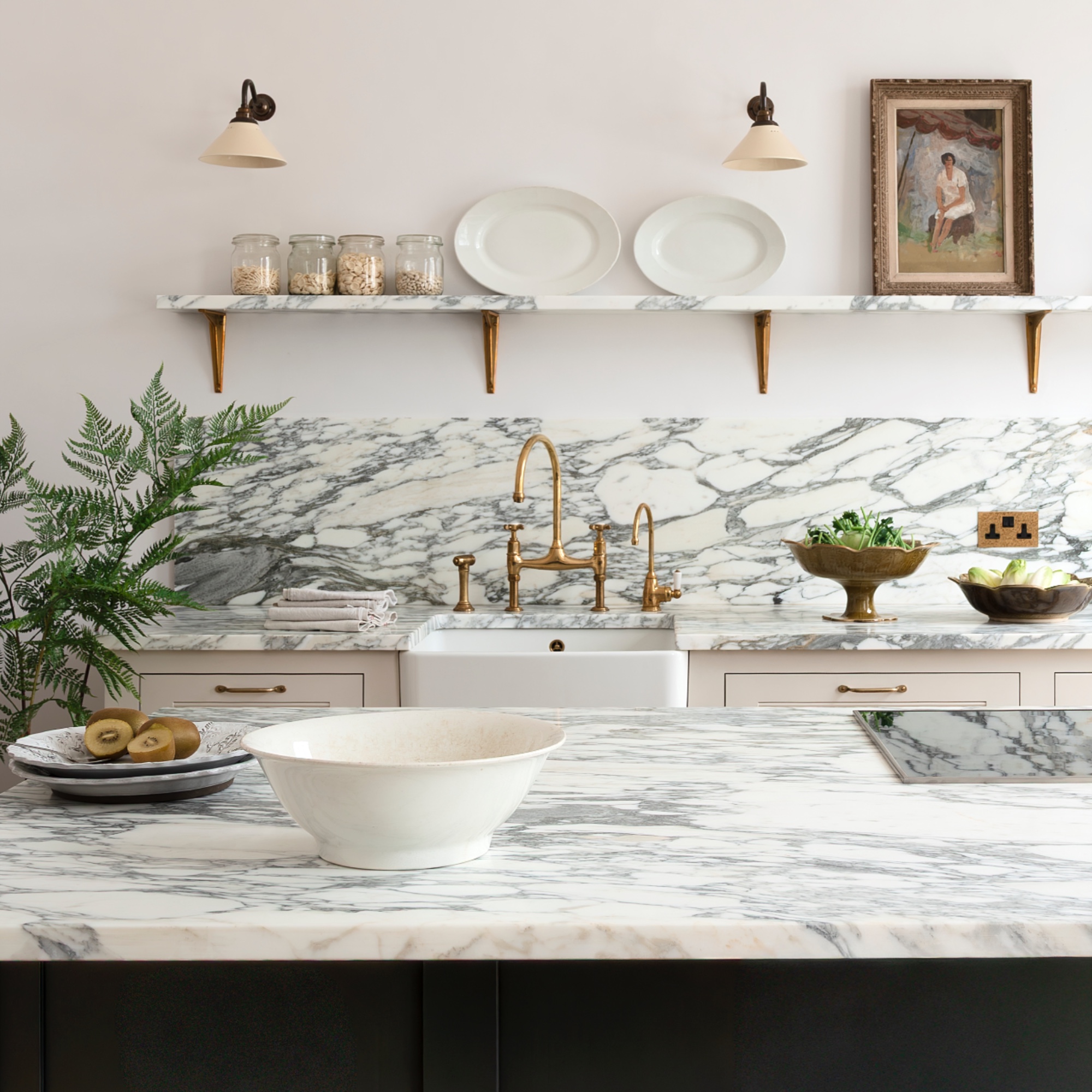 white and marble kitchen with open shelf, marble work tops, kitchen island