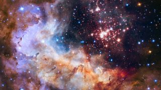 Clouds of pink, purple, orange and blue sit next to a bunch of white dots over a black background