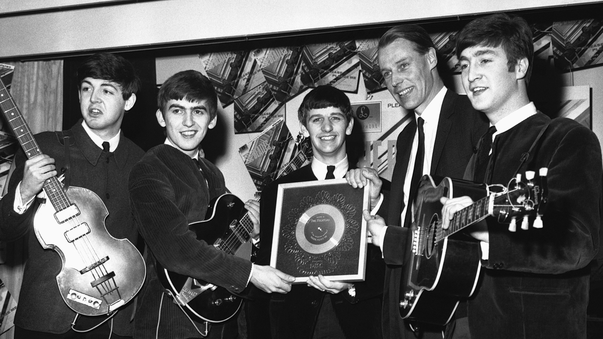 George Martin (second from right) with the Beatles in 1962.