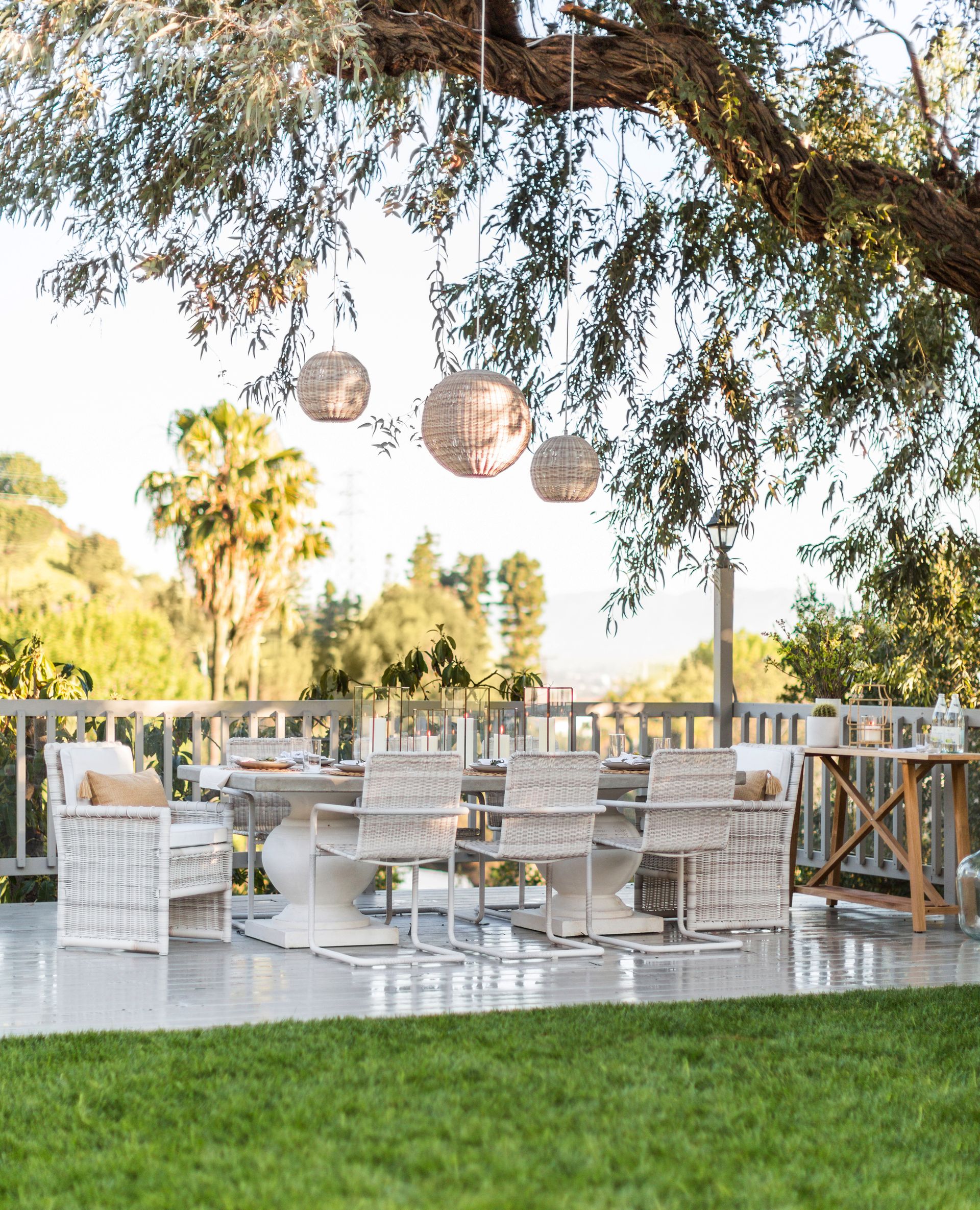 An outdoor dining room with hanging lights