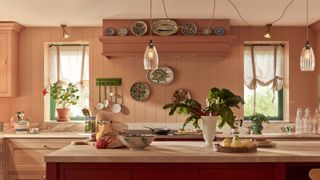 voile curtains tied up at two small kitchen windows