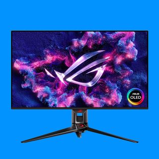 An Asus OLED gaming monitor on a blue background.