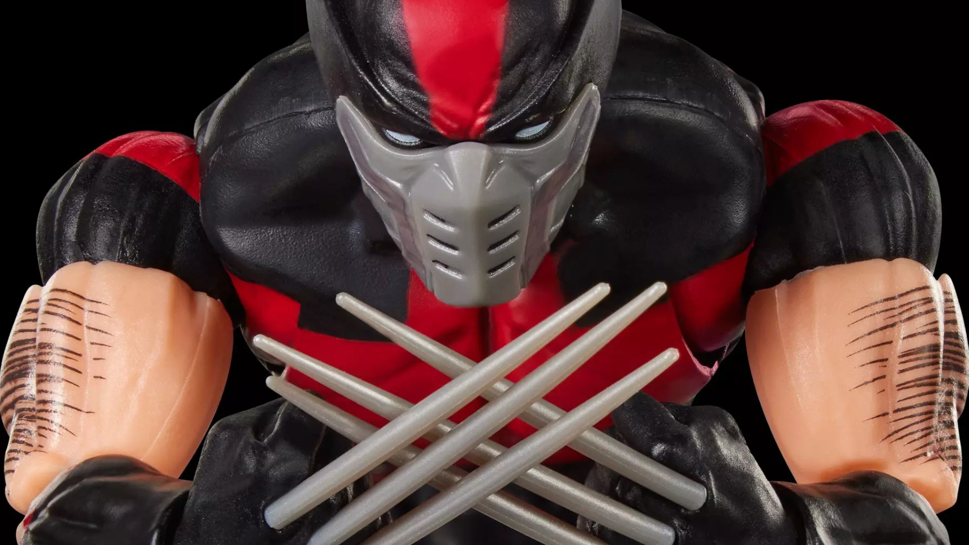 Marvel Legends Ultimate Wolverine crosses his claws while standing against a dark background
