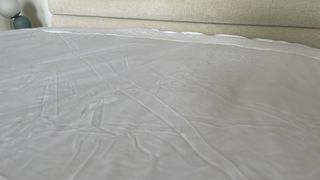 The Soak & Sleep Anti-Bed Bug Mattress Encasement on the bed