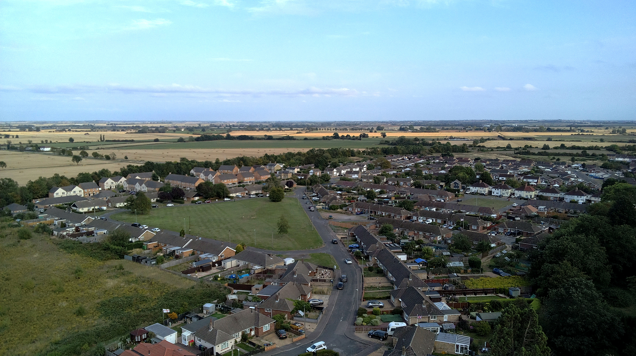 Photo of of the edge of a countryside town taken with a Bwine F7GIM drone