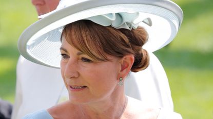 Previously-unseen photo of Carole Middleton for Mother's Day explained. Seen here she attends day 1 of Royal Ascot 