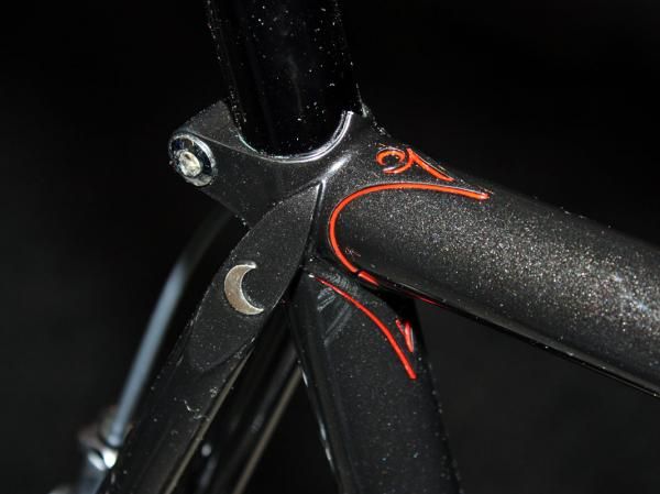 Intricate lug carving and excellent pinstriping mark this Peter Mooney seat cluster.