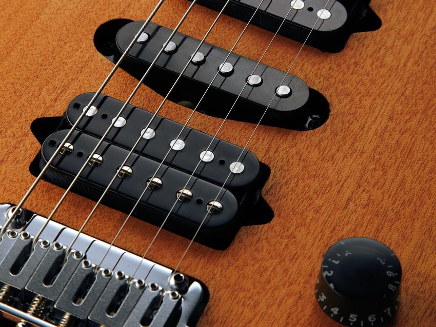 The Suhr-made pickups are screwed directly into the mahogany body.