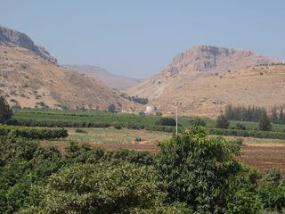 View looking southwest showing the mountains bounding the Ginosar Valley in Israel. Archaeologists found pottery remains, cubes known as tesserae and, in the modern town, architectural fragments indicating a town flourished in the area from the second or first century B.C. until after the fifth century A.D.