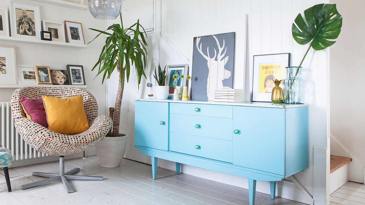 White living room with sideboard painted bright blue