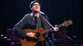 : James Taylor performs onstage during The Rainforest Fund 30th Anniversary Benefit Concert Presents 'We'll Be Together Again' at Beacon Theatre on December 09, 2019 in New York City