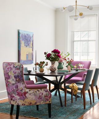 formal dining table with floral chairs and vases