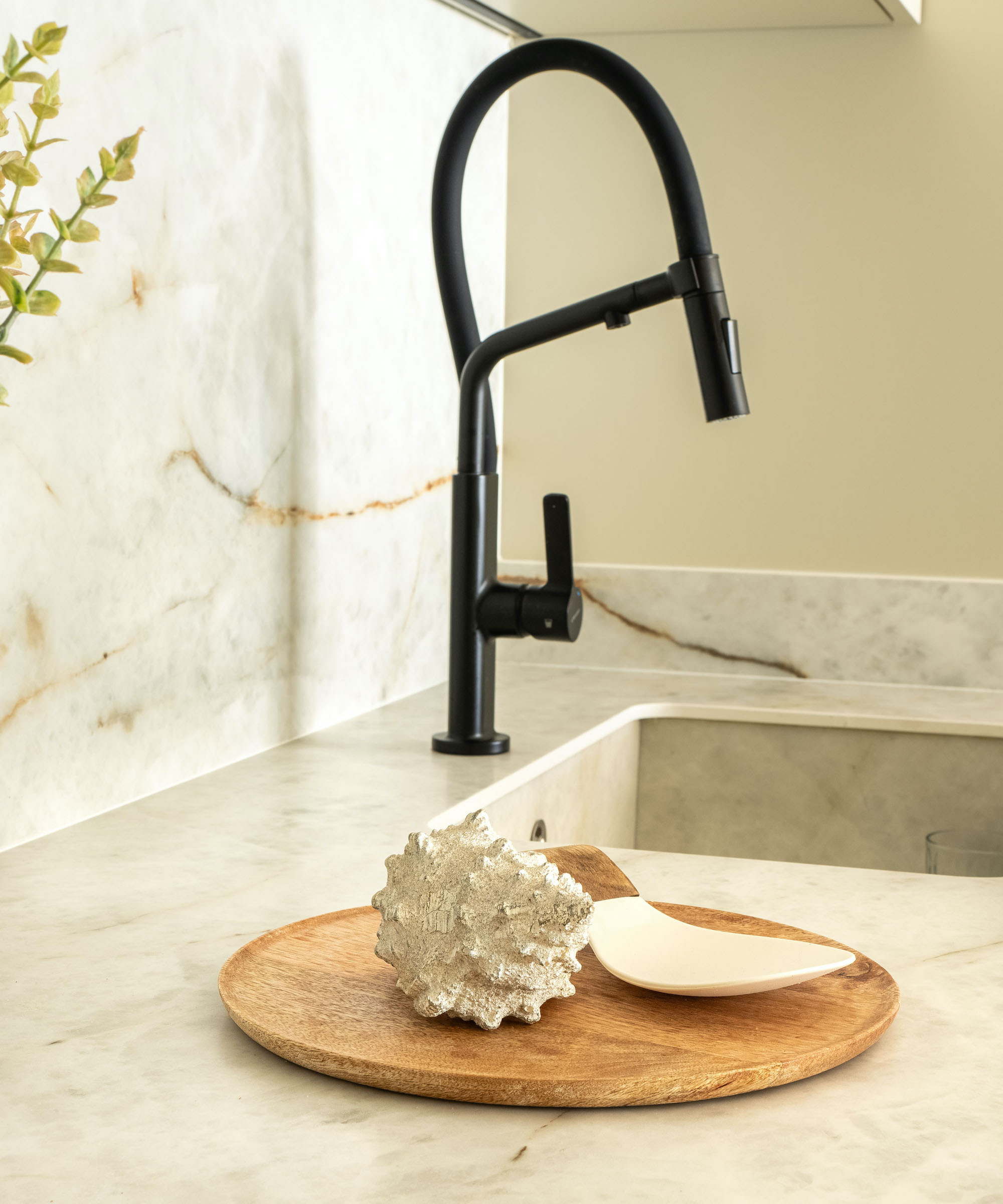 close up of kitchen sink and tap and porcelain worktops