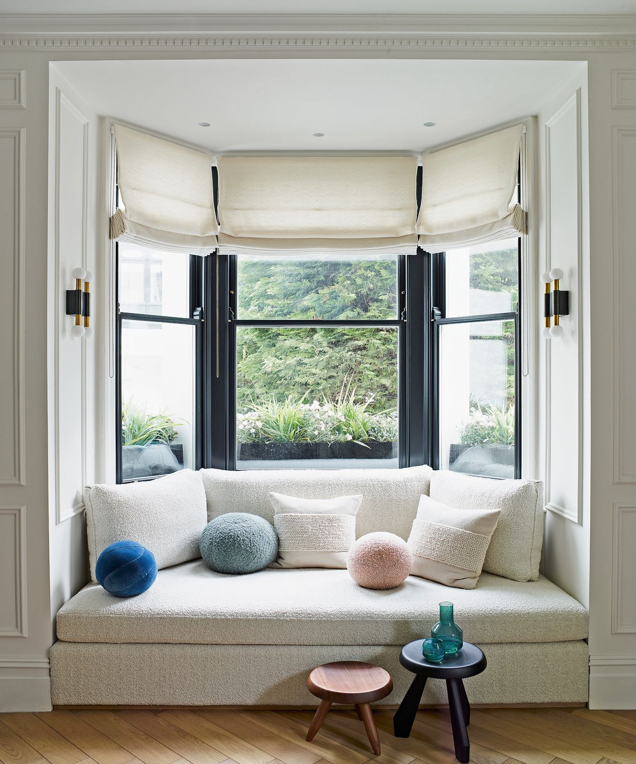 Built in window seat in bay window in neutral living room