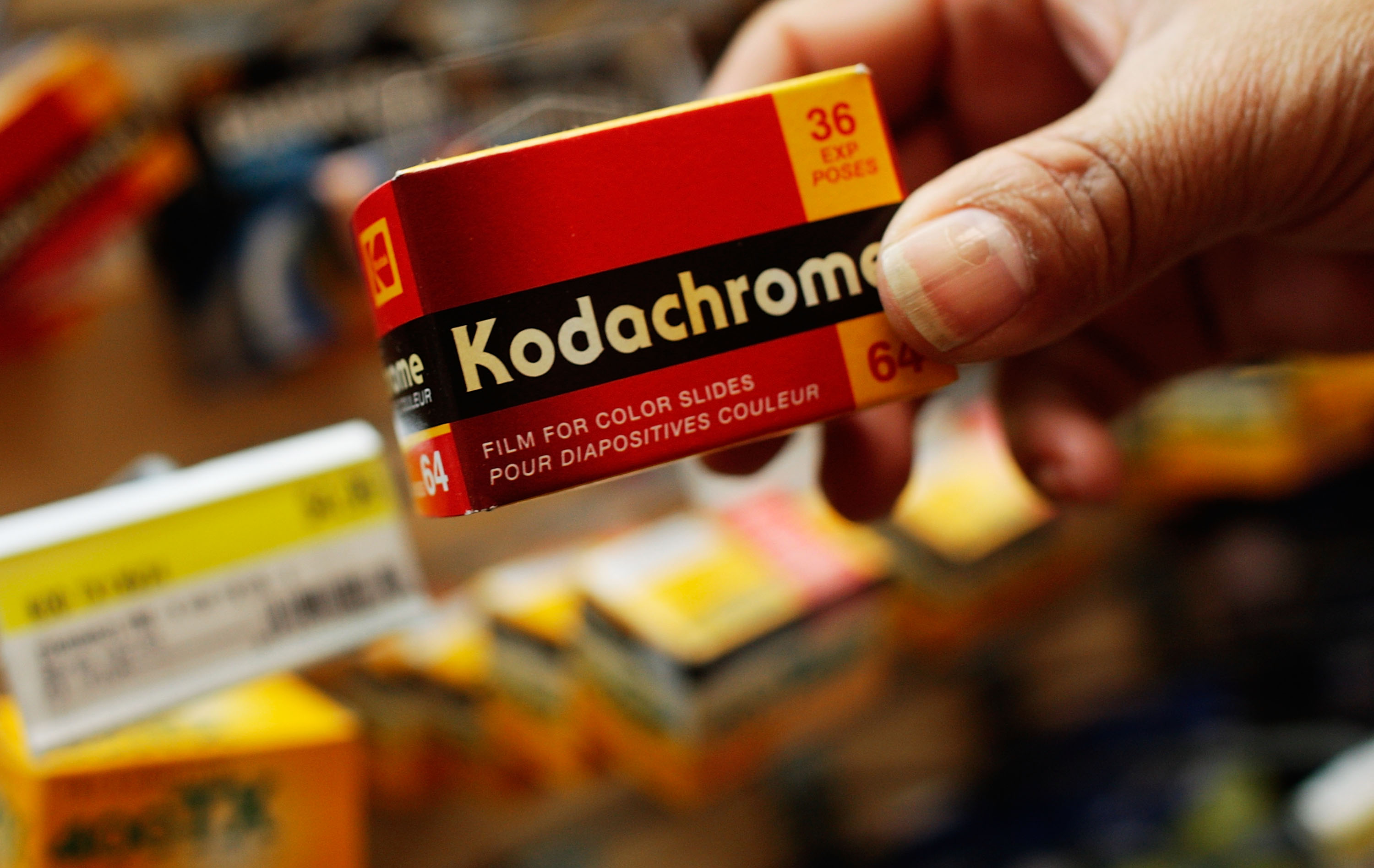 A person holding Kodachrome film