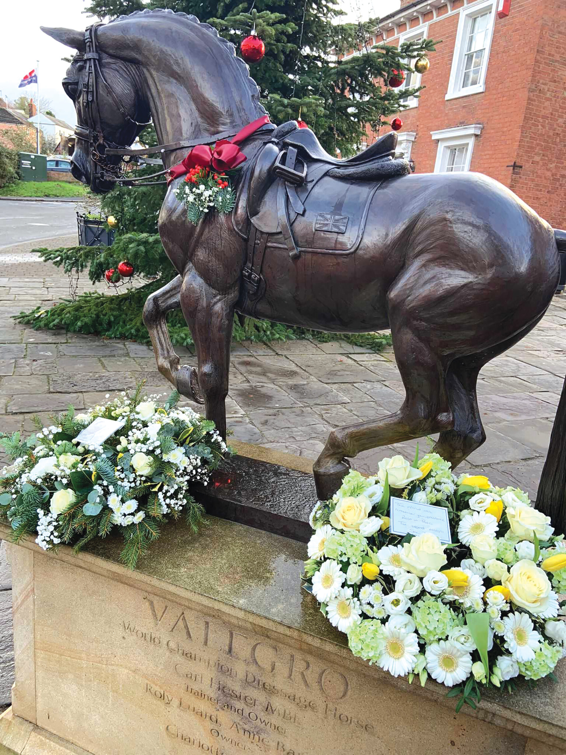 Valegro's statue with wreaths at the base marking his passing.