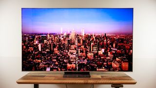 A TCL QM8L TV on a desk