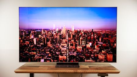 A TCL QM8L TV on a desk