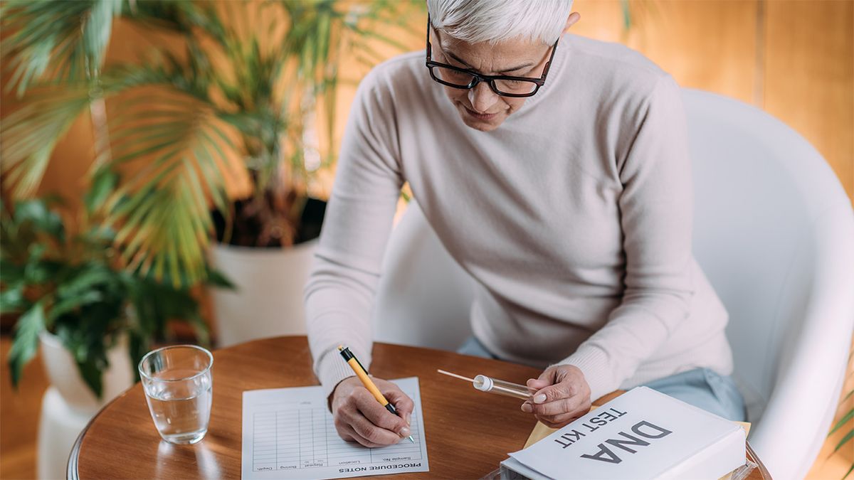 Woman completing an at-home DNA testing kit