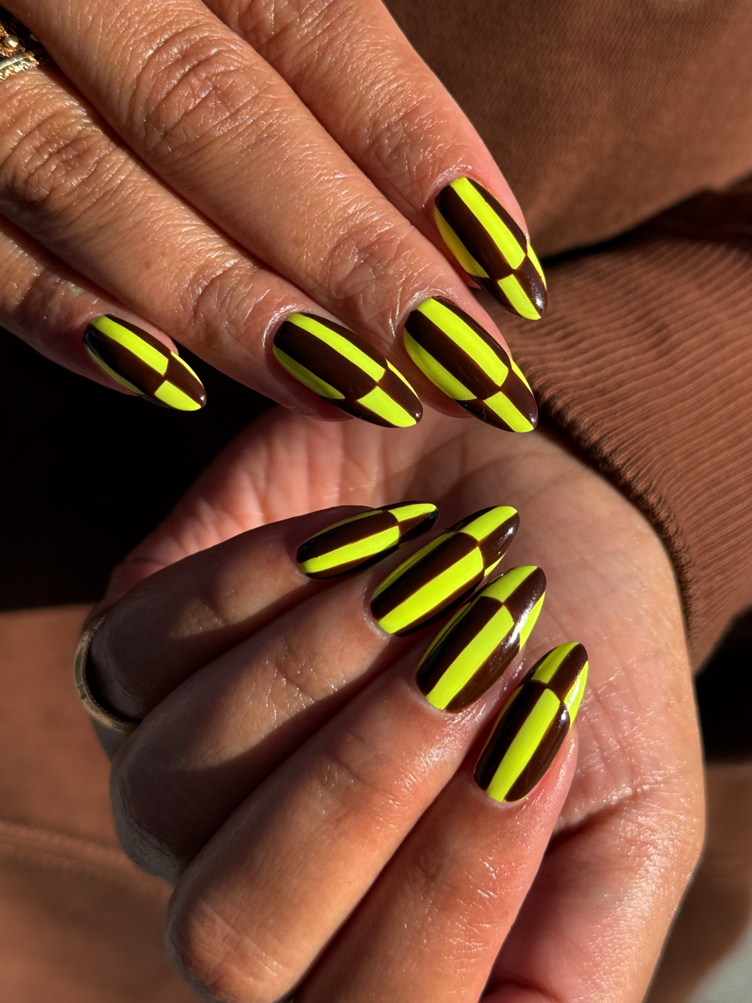 A blocky design in neon yellow and dark brown.