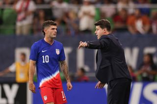 United States coach Mauricio Pochettino gives instructions to Christian Pulisic during a game against Panama in October 2024.