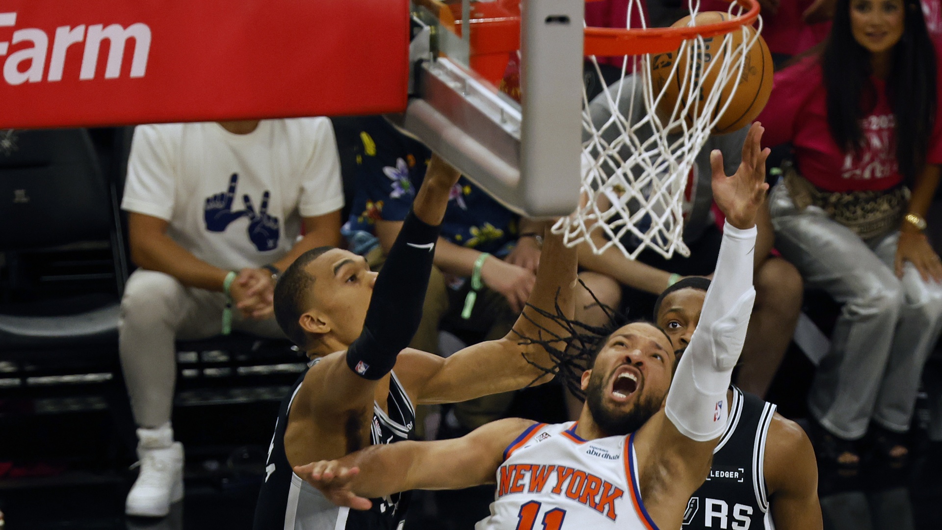 The New York Knicks' Jalen Brunson shoots against San Antonio Spurs' Victor Wembanyama in Game 1 of the 2026 NBA Finals