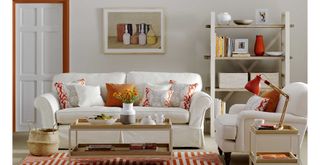 warm white living room with rust colour accent accessories on white sofas