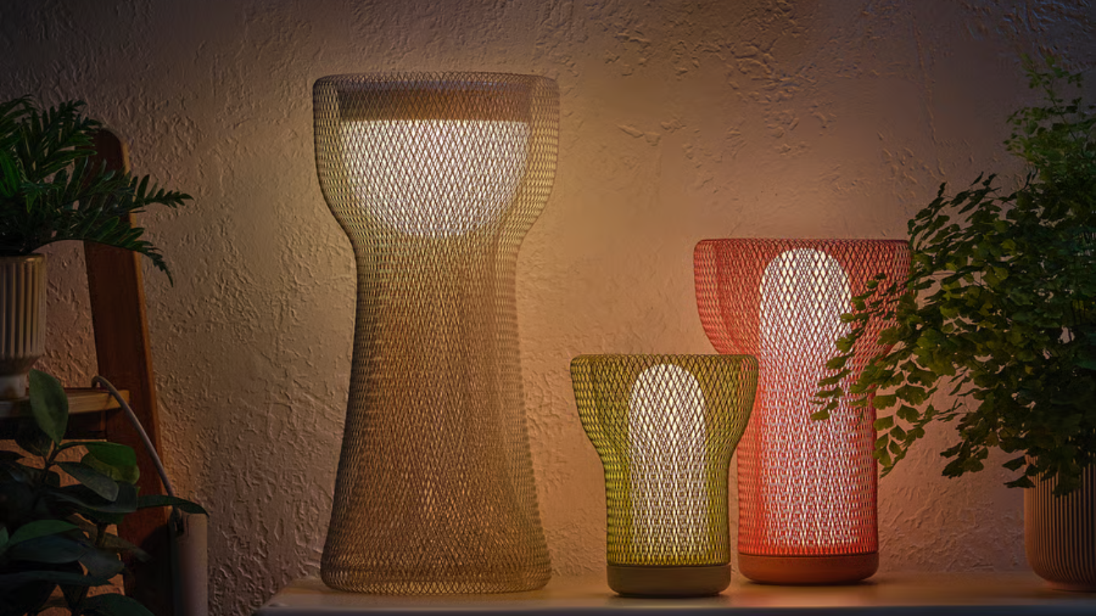 a yellow mesh outdoor lamp from ikea along with two other similar models