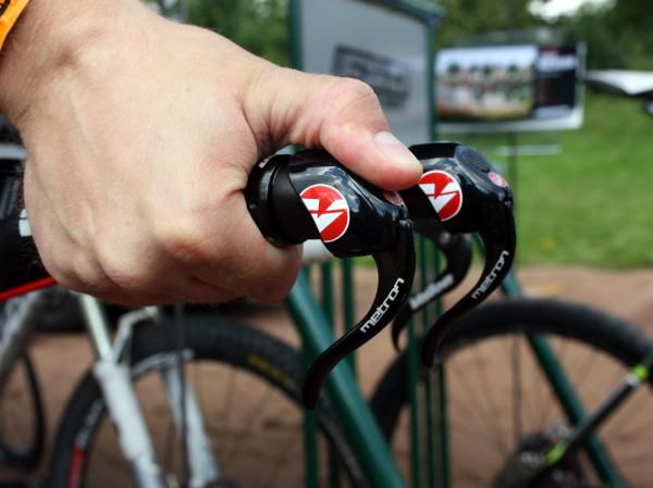 To release cable, rest your thumb over the end of the lever body and push it like a button.