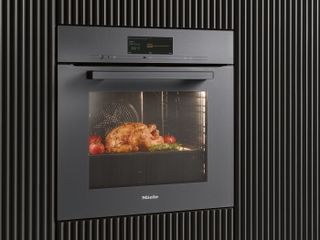 smart oven with built in camera in a black kitchen