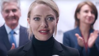 Amanda Seyfried as Elizabeth Holmes smiling during the Hulu show, The Dropout.