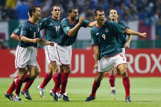 Jared Borgetti (right) celebrates with his Mexico team-mates after scoring against Italy at the 2002 World Cup.
